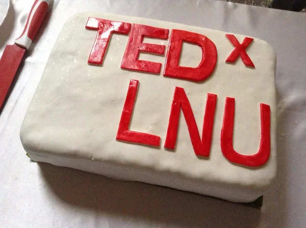 White and red cake was created for celebarion one of the TEDx event — Stock Photo, Image