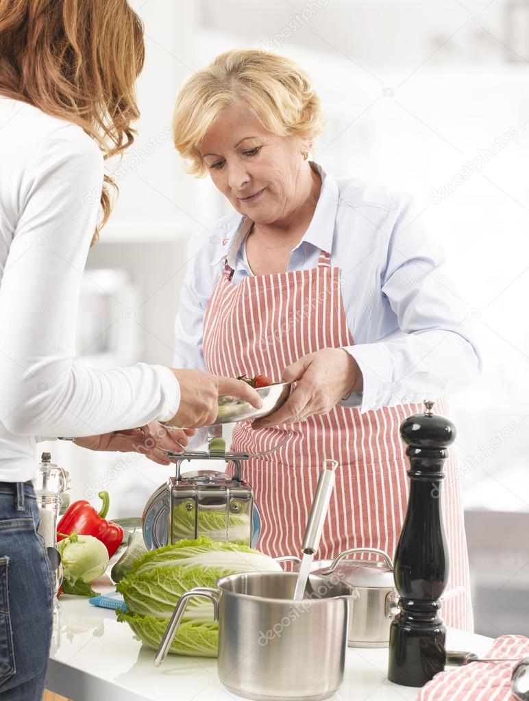 Two Women cooking In The Kitchen