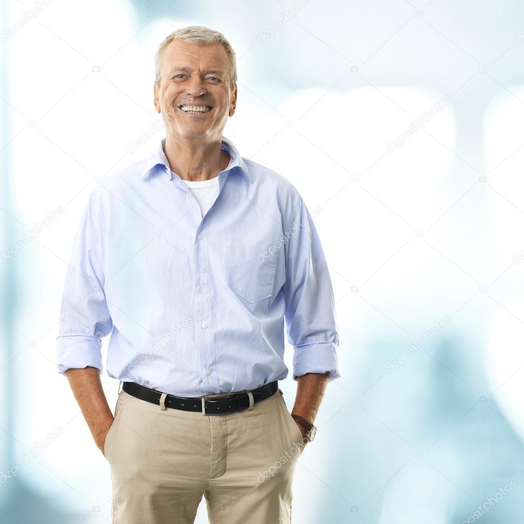 Senior Businessman And Smiling Portrait Of A Senior Businessman Smiling Stock Photo