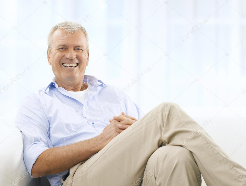 Smiling Senior Man On Couch