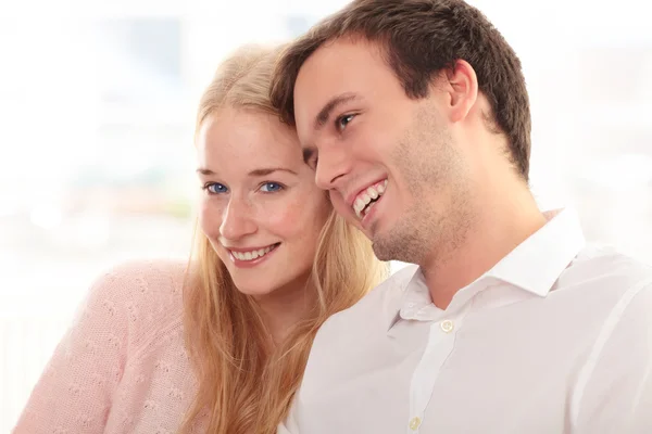 Portrait of a happy couple sitting together — Stock Photo, Image