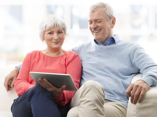 Senior Couple With Digital Tablet Royalty Free Stock Photos