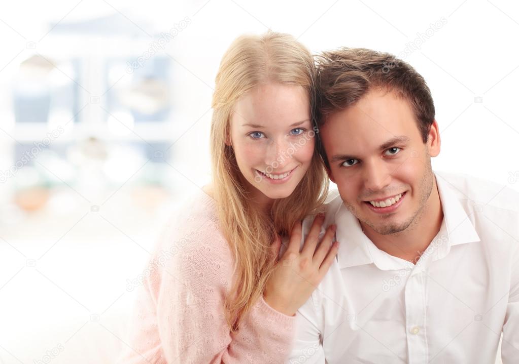 Young woman embracing her boyfriend