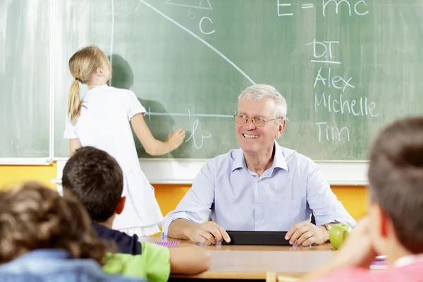 Professor e aluno em uma lição . — Fotografia de Stock