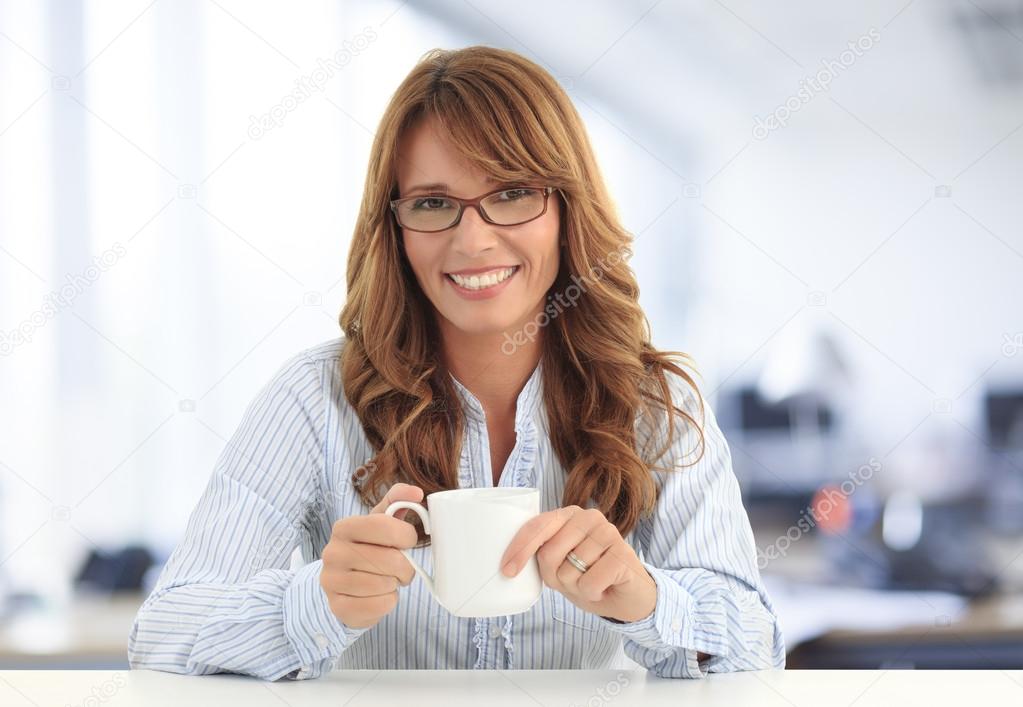 Businesswoman drinking coffee