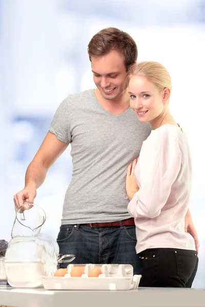 Happy couple in kitchen — Stock Photo, Image