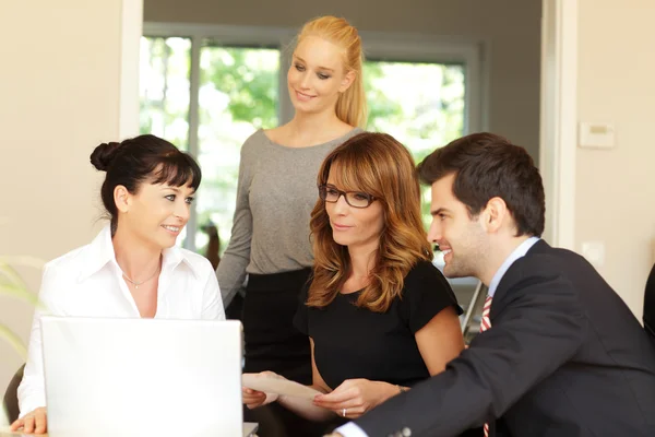 Business colleagues working on a laptop — Stock Photo, Image