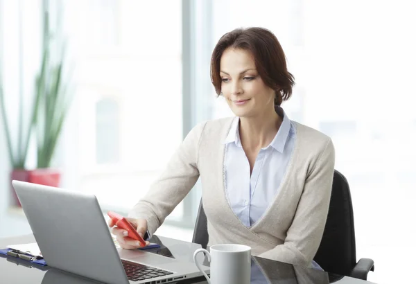 Beautiful business woman with laptop Royalty Free Stock Photos
