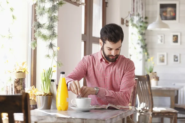 Modern young man at coffee shop — Stock Photo, Image