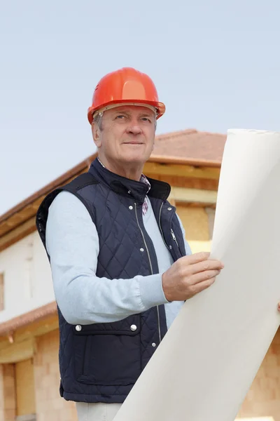 Senior architect with blueprint — Stock Photo, Image