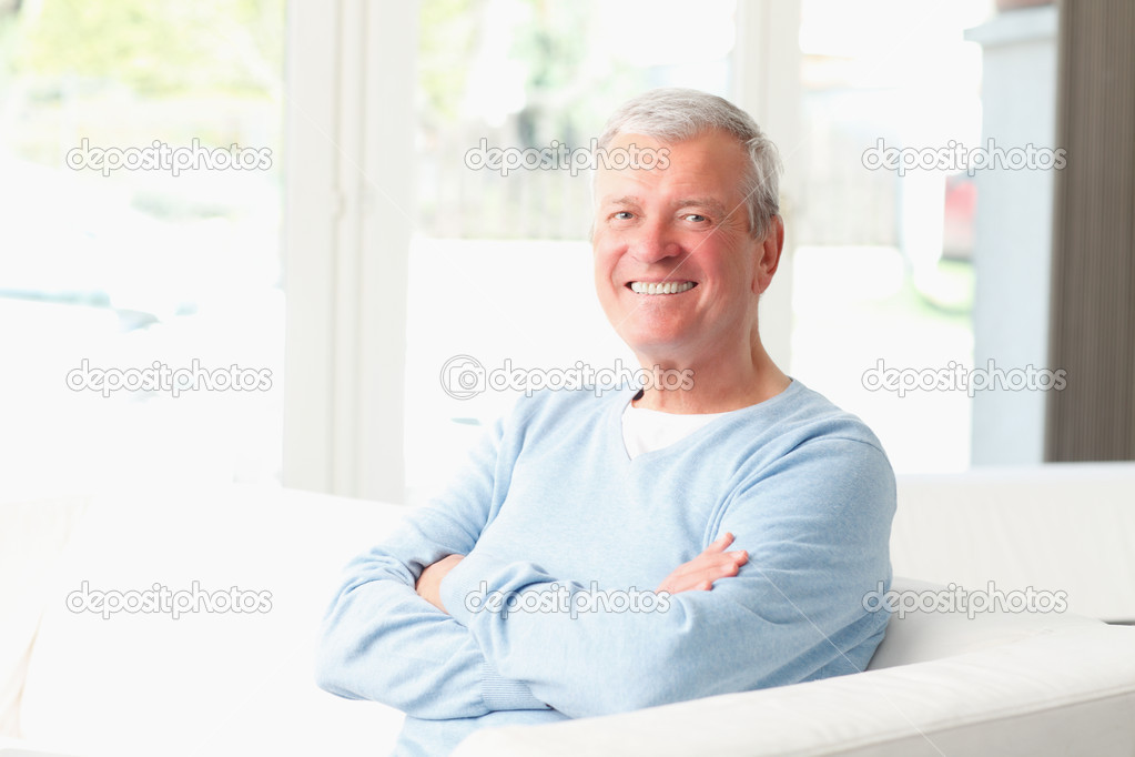 Senior man sitting on sofa