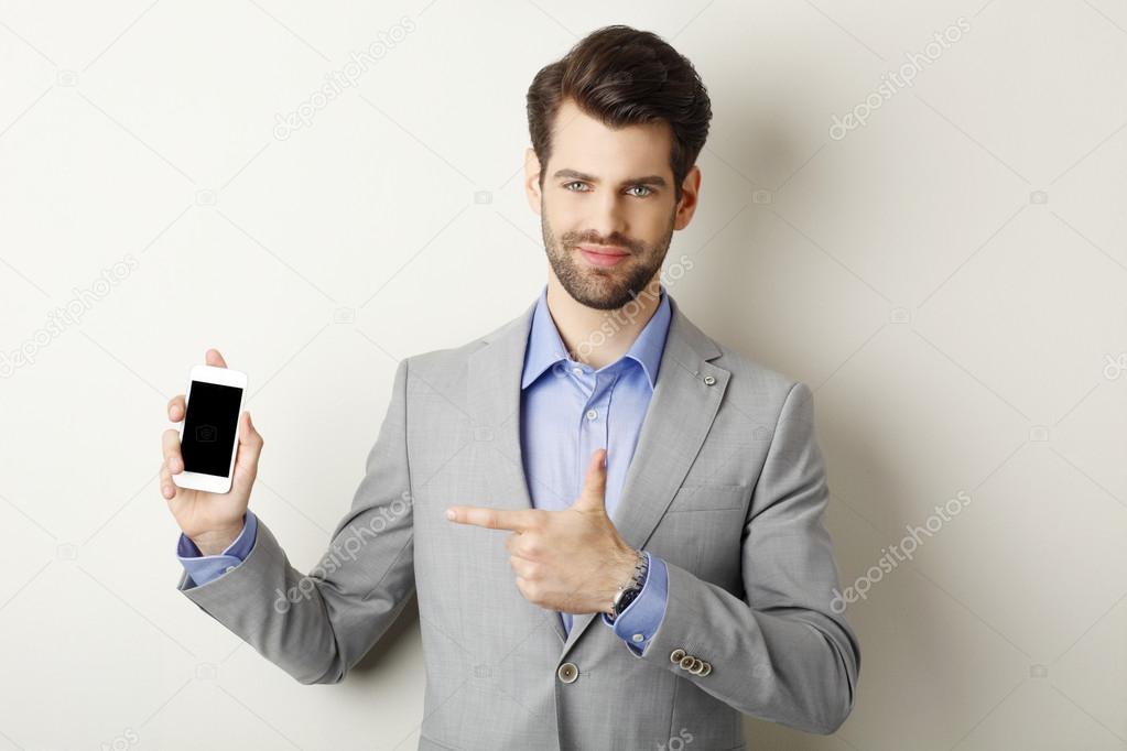 Young man holding mobile
