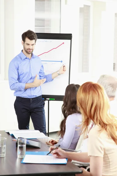 Young businessman presenting — Stock Photo, Image