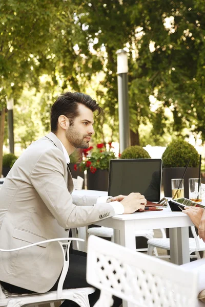 Businessman in coffee shop making financial plan — Stock Photo, Image