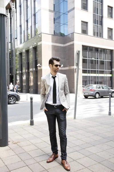 Businessman in front of business center — Stock Photo, Image