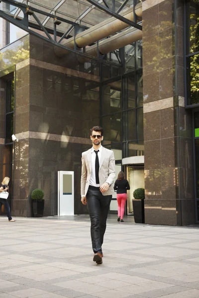 Businessman in front of business center — Stock Photo, Image