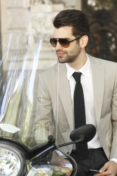 Modern businessman with scooter — Stock Photo, Image