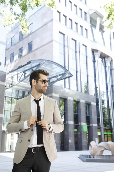 Businessman in front of business center — Stock Photo, Image