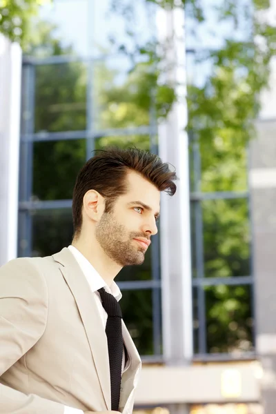 Modern broker in front of stock exchange — Stock Photo, Image