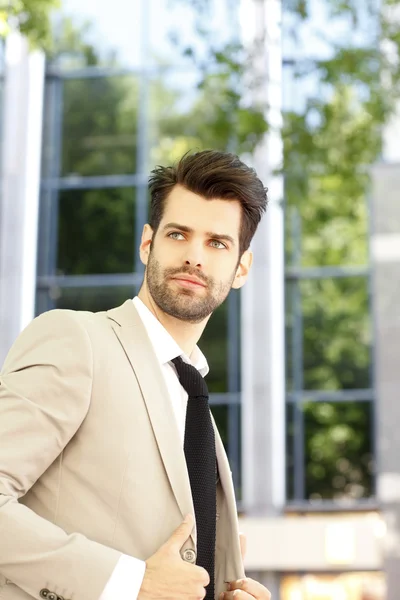 Modern broker in front of stock exchange — Stock Photo, Image