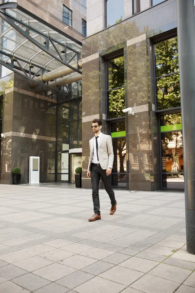 Modern broker in front of stock exchange — Stock Photo, Image