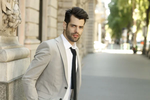 Businessman standing on street — Stock Photo, Image