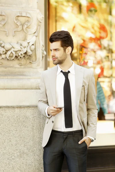 Businessman standing on street — Stock Photo, Image