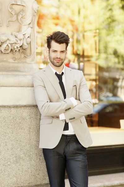 Businessman standing on street — Stock Photo, Image