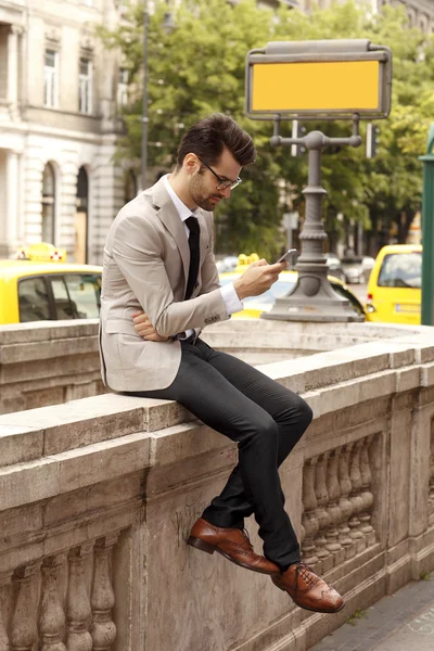 Modern businessman at the city — Stock Photo, Image