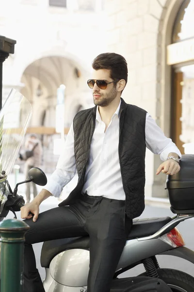 Businessman with scooter on the street — Stock Photo, Image