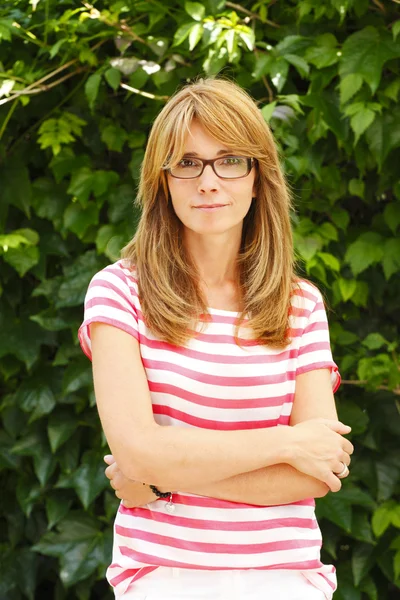 Positive mature woman standing — Stock Photo, Image