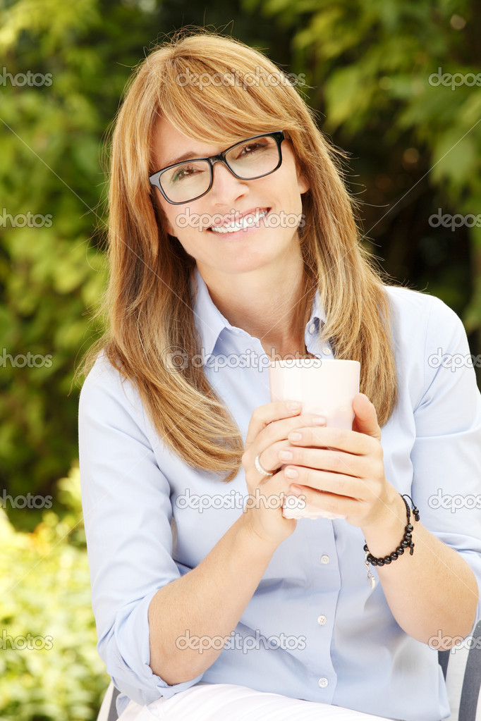 Lady with mug in garden