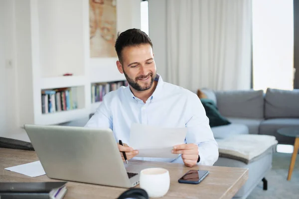 Smiling Businessman Working Home While Sitting His Laptop Doing Some — Stock Photo, Image