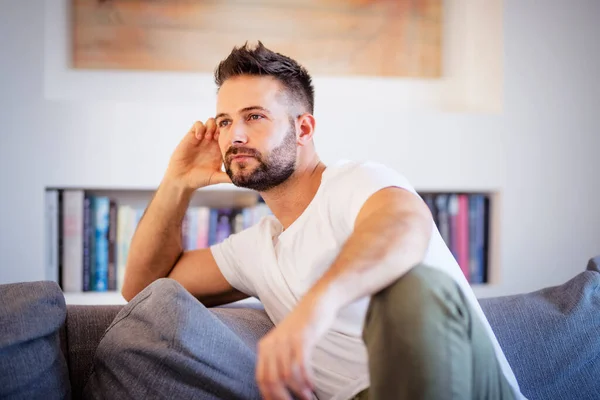 Shot Man Wearing Casual Clothes Looking Thoughtfully While Relaxing Couch — Stock Photo, Image