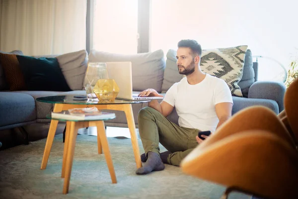 Handsome Man Using Laptop While Relaxing Home — Stock Photo, Image