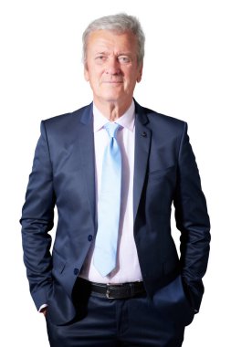 Studio portrait of grey haired businessman wearing suit while standing at isolated white background. Copy space.