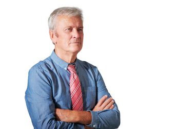 Studio portrait of senior businessman standing at isolated white background. 