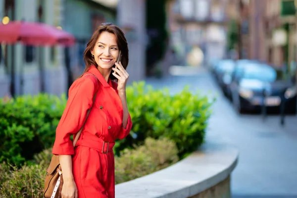 Portrait Smiling Woman Walking Street Using Mobile Phone City Life - Stock-foto