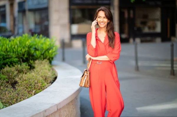 Smiling Middle Aged Woman Talking Smartphone Beautiful Female Wearing Red — стоковое фото