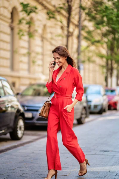 Smiling Middle Aged Woman Talking Smartphone Beautiful Female Wearing Red — Φωτογραφία Αρχείου