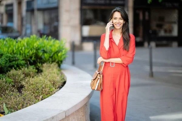 Smiling Middle Aged Woman Talking Smartphone Beautiful Female Wearing Red — Φωτογραφία Αρχείου