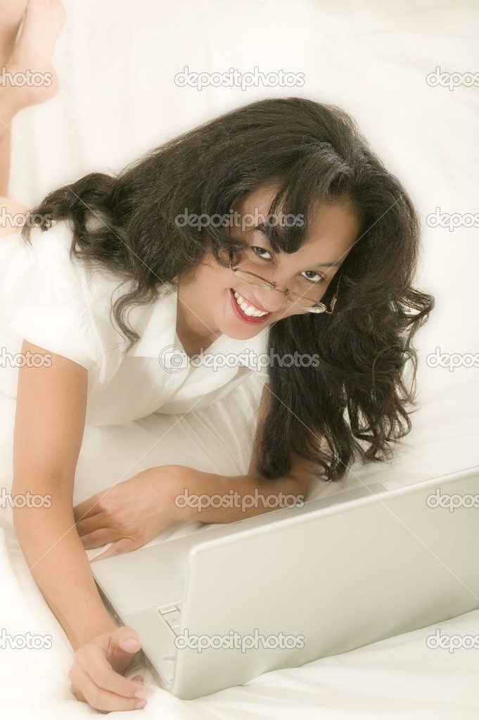 woman in bed with laptop