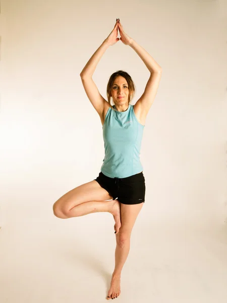 Woman doing yoga exercise — Stock Photo, Image