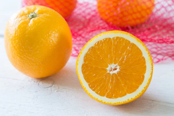 Pomarańcze w sieci — Zdjęcie stockowe