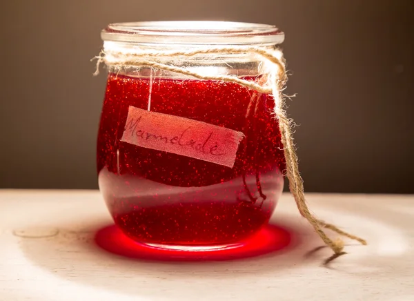 Jam in a jar with cord — Stock Photo, Image
