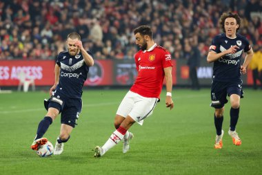 MELBOURNE, AUSTRALIA - JULY 15: Josh Brillante of Melbourne Victory plays against Bruno Fernandes of Manchester United in a pre-season friendly football match at the MCG on 15th July 2022