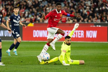 MELBOURNE, AUSTRALIA - JULY 15: Marcus Rashford of Manchester United runs with the ball and scores against Melbourne Victory in a pre-season friendly football match at the MCG on 15th July 2022