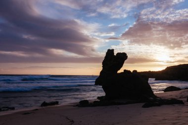 The lesser known Monforts Beach and Rabbit Rock with rockpool formations on a sunny day in Blairgowrie, Victoria, Australia