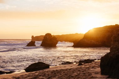 The lesser known Monforts Beach and Rabbit Rock with rockpool formations on a sunny day in Blairgowrie, Victoria, Australia