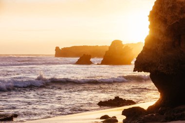 The lesser known Monforts Beach and Rabbit Rock with rockpool formations on a sunny day in Blairgowrie, Victoria, Australia